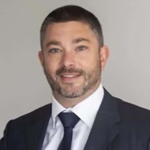 man in a suit and tie posing for a picture